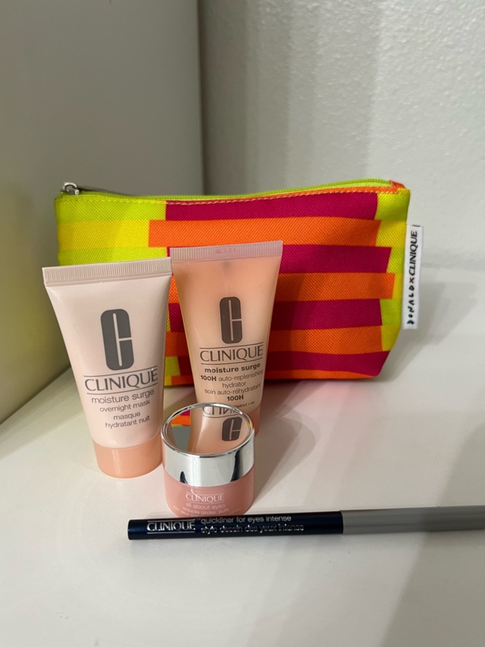 Clinique New Pink Moisture Surge Trio with Bright Striped Pouch